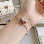 Bracelet Papillon 250e Anniversaire des États-Unis : Pendentif en Résine Dorée